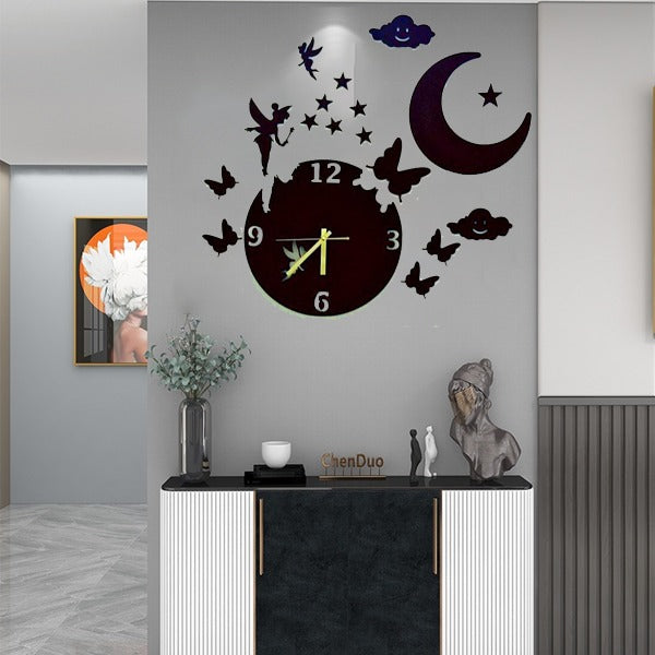 Decorative wall clock with butterfly and moon design on a gray wall.